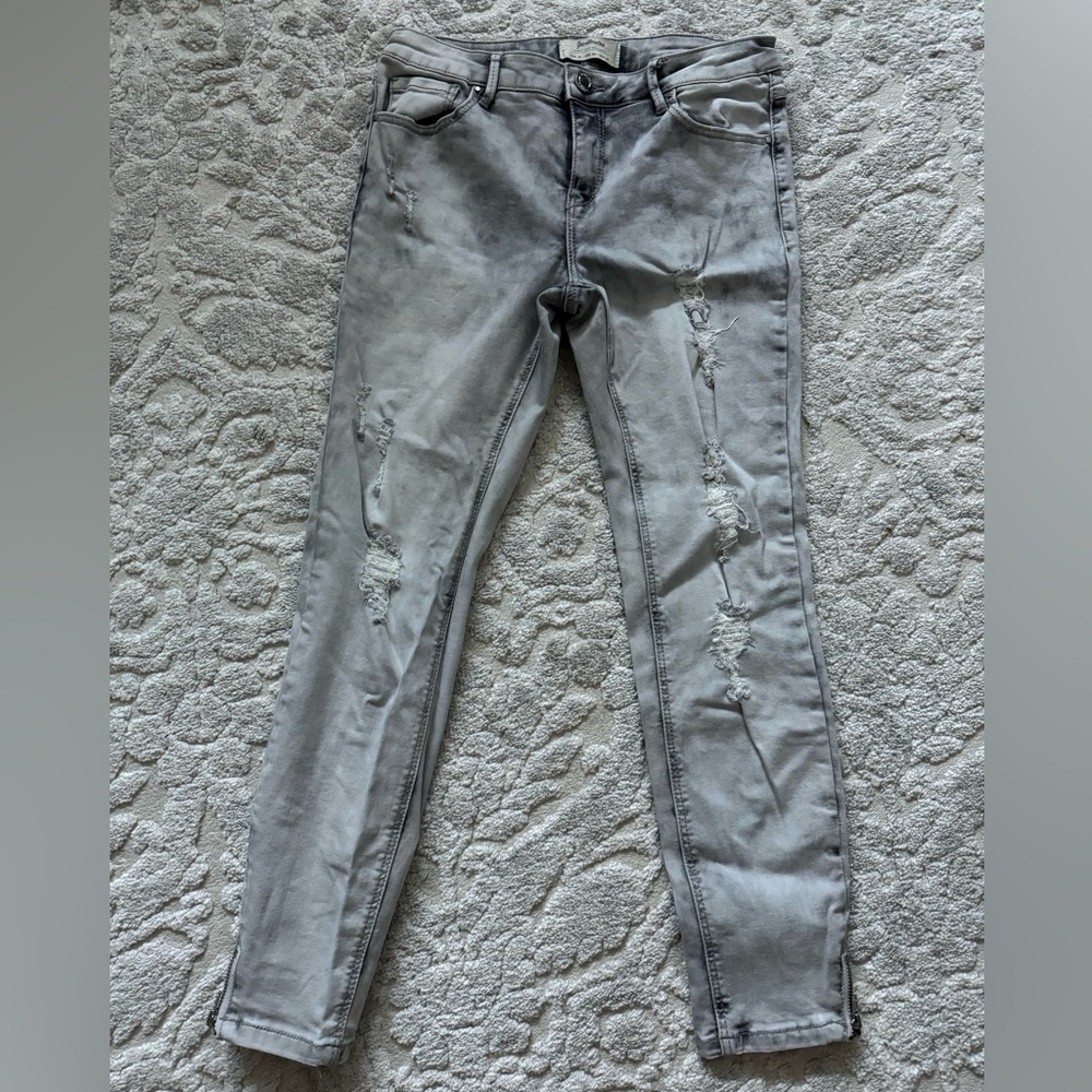 Light washed grey ripped skinny jeans